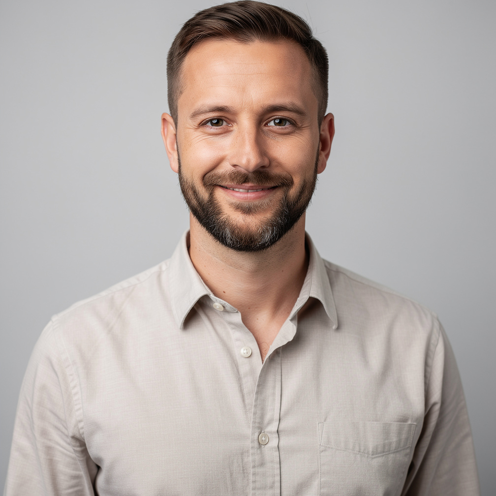 Studio portrait of a German man in his thirties with short beard